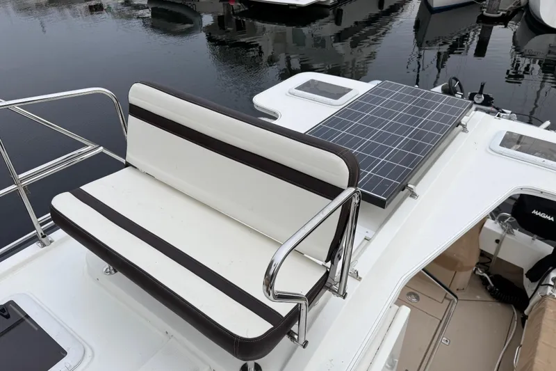 Slide: The Image of 2017 Ranger Tugs R-31 CB boat with solar panel and cushioned seating on deck. - 78