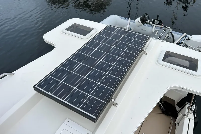 Slide: The Image of Solar panel on 2017 Ranger Tugs R-31 CB boat, docked on calm water. - 79