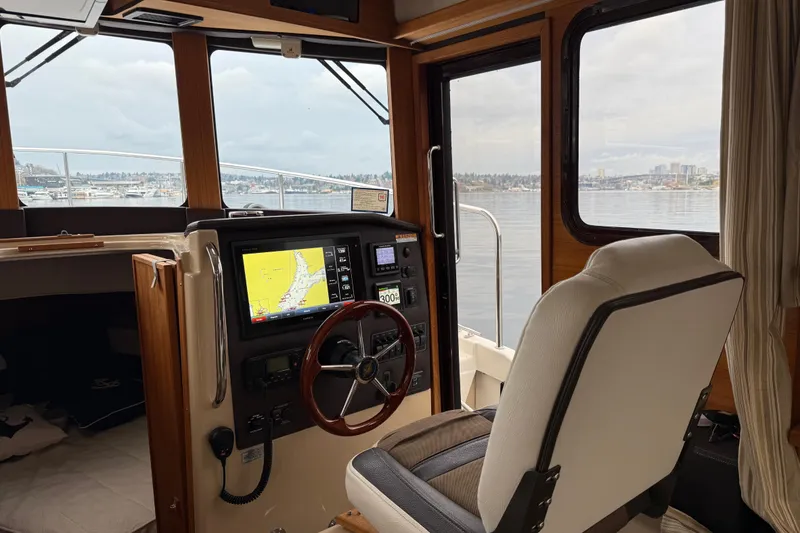 Slide: The Image of Interior view of 2017 Ranger Tugs R-31 CB boat cockpit with navigation system. - 8
