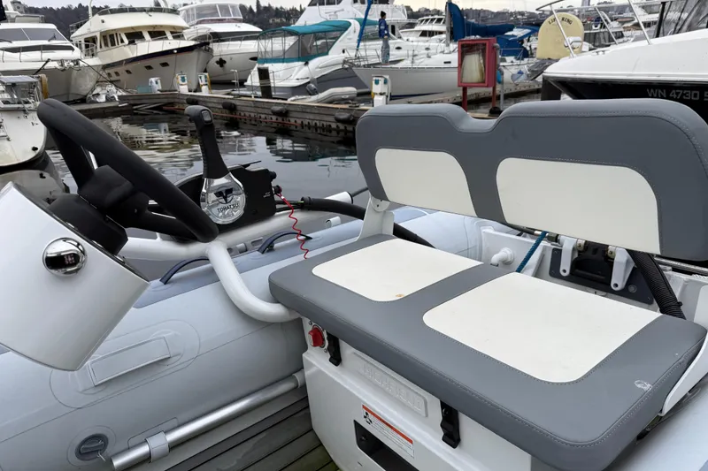 Slide: The Image of Cockpit view of a 2017 Ranger Tugs R-31 CB at a marina. - 86