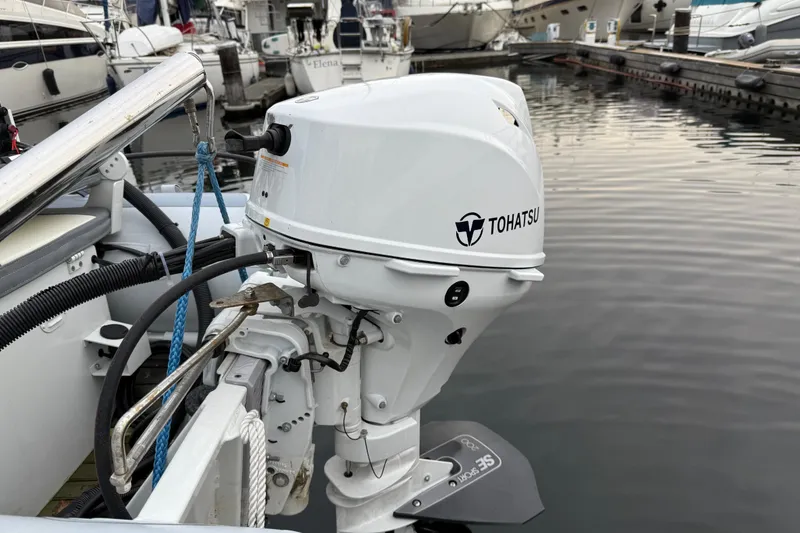 Slide: The Image of Tohatsu outboard motor on a 2017 Ranger Tugs R-31 CB at a marina. - 87