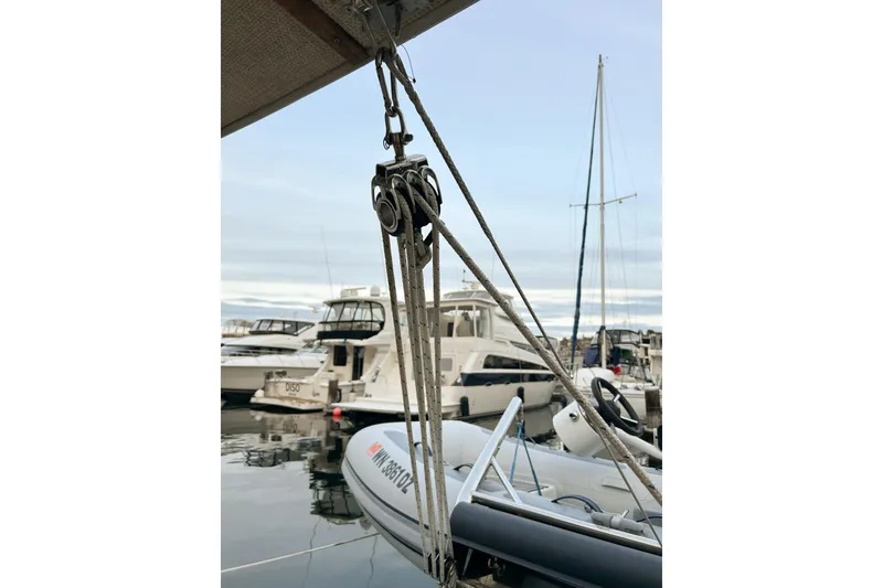Slide: The Image of Docked Ranger Tugs R-31 CB boat with rigging, 2017 model, in a marina setting. - 89