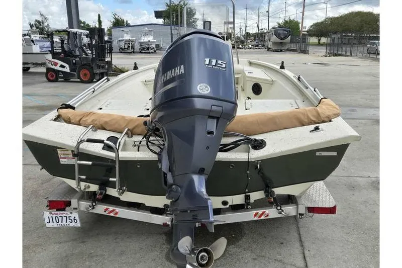 Slide: The Image of 2012 Xpress H20 boat with Yamaha 115 outboard motor on trailer. - 12
