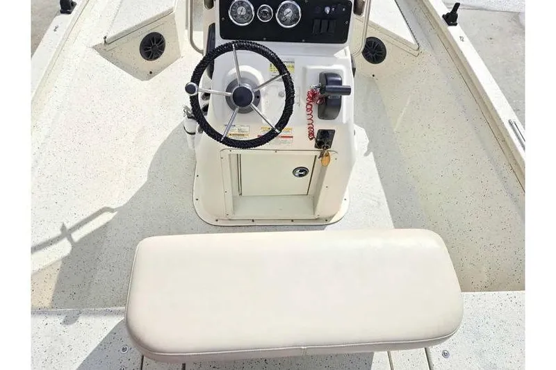Slide: The Image of 2012 Xpress H20 boat console with steering wheel and controls. - 14