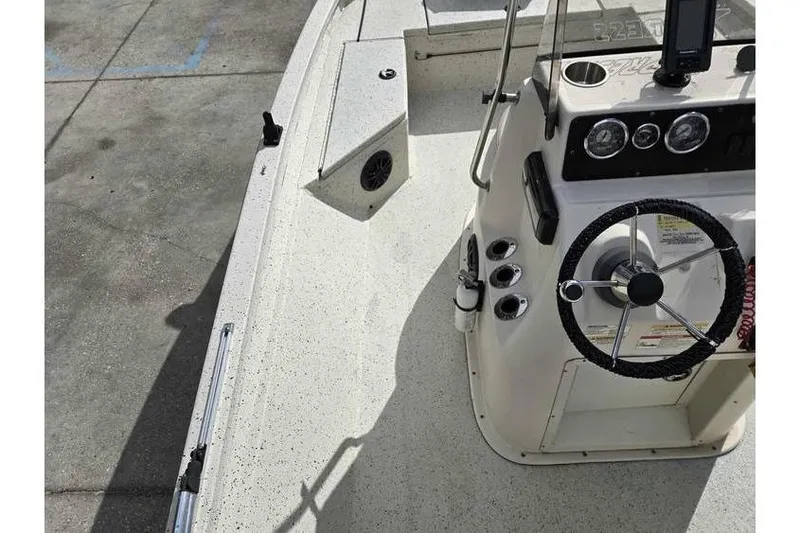 Slide: The Image of 2012 Xpress H20 boat interior with steering wheel and control panel. - 4