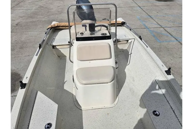 Slide: The Image of 2012 Xpress H20 boat interior with steering console and seating. - 5