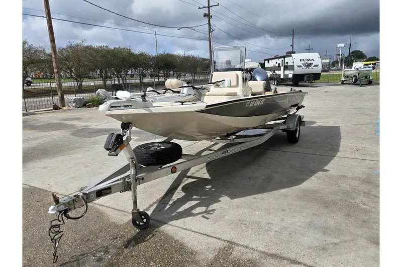 Slide: The Image of 2012 Xpress H20 boat on trailer in parking lot, overcast sky. - 7