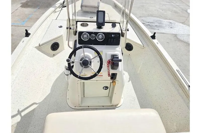 Slide: The Image of 2012 Xpress H20 boat console with steering wheel and navigation equipment. - 8