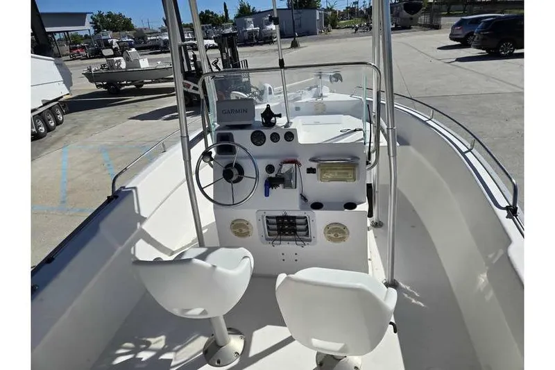 Slide: The Image of 2002 Cape Horn 17 CC boat interior with steering wheel and navigation equipment. - 9