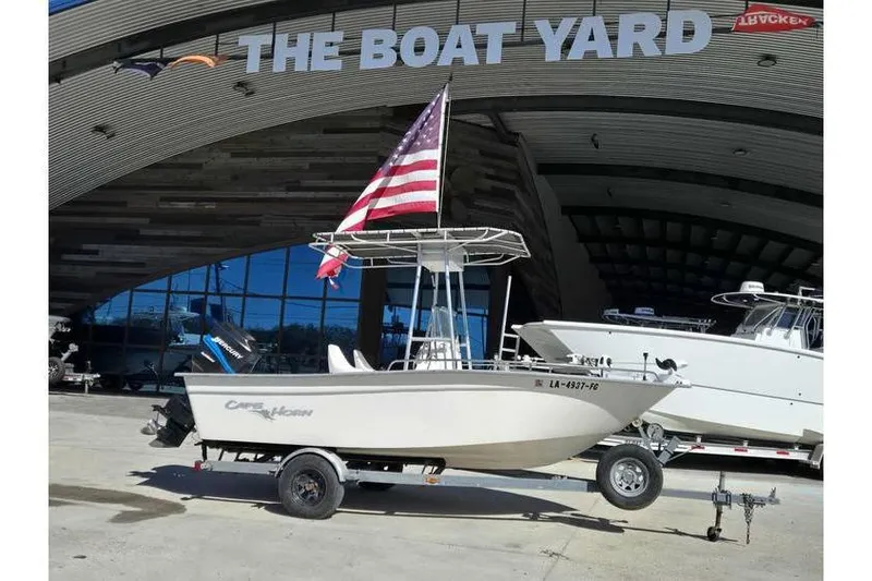 Slide: The Image of 2002 Cape Horn 17 CC boat with American flag at The Boat Yard. - 1