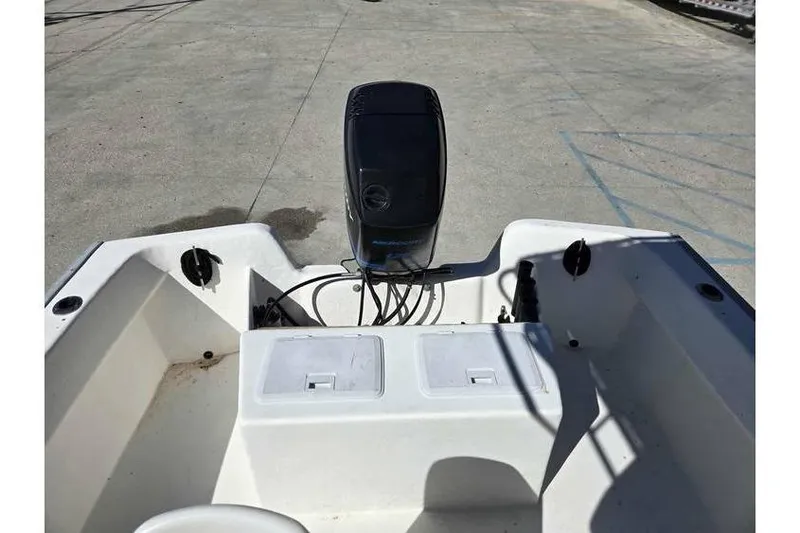 Slide: The Image of 2002 Cape Horn 17 CC boat with outboard motor, viewed from the rear deck. - 10