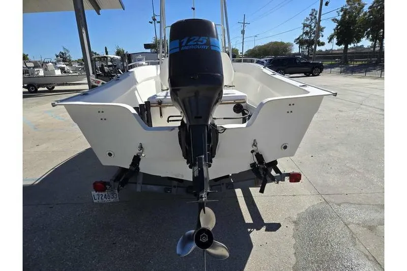 Slide: The Image of 2002 Cape Horn 17 CC boat with Mercury 125 outboard motor, rear view. - 7
