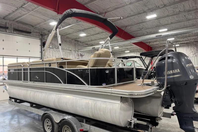 Slide: The Image of 2014 Bennington S 24 pontoon boat with Yamaha 200 engine in a warehouse setting. - 3