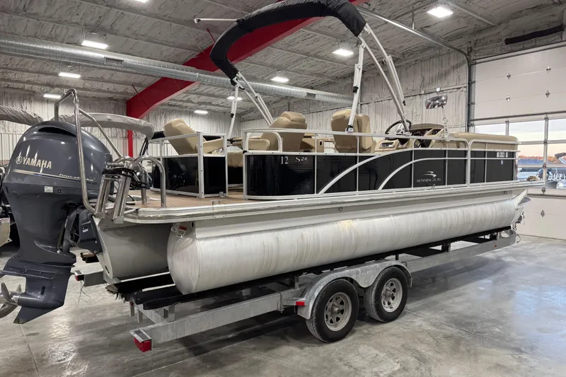 Slide: The Image of 2014 Bennington S 24 pontoon boat on trailer in indoor storage facility. - 4