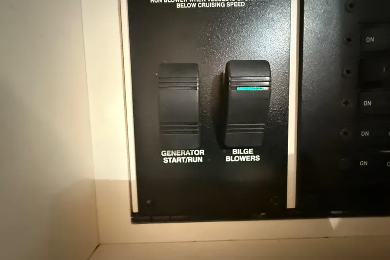 Slide: The Image of Control panel of a 2000 Sea Ray 270 Sundancer with generator and bilge blower switches. - 15