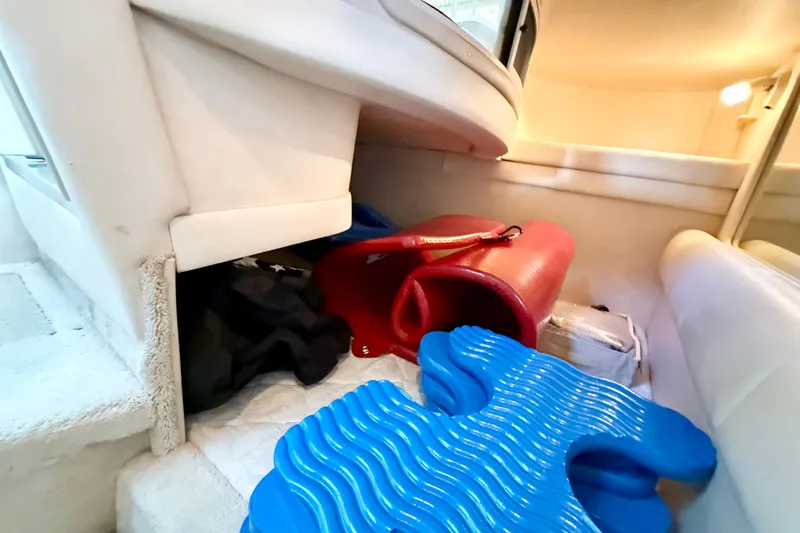 Slide: The Image of Interior of 2000 Sea Ray 270 Sundancer with storage items and seating area. - 17