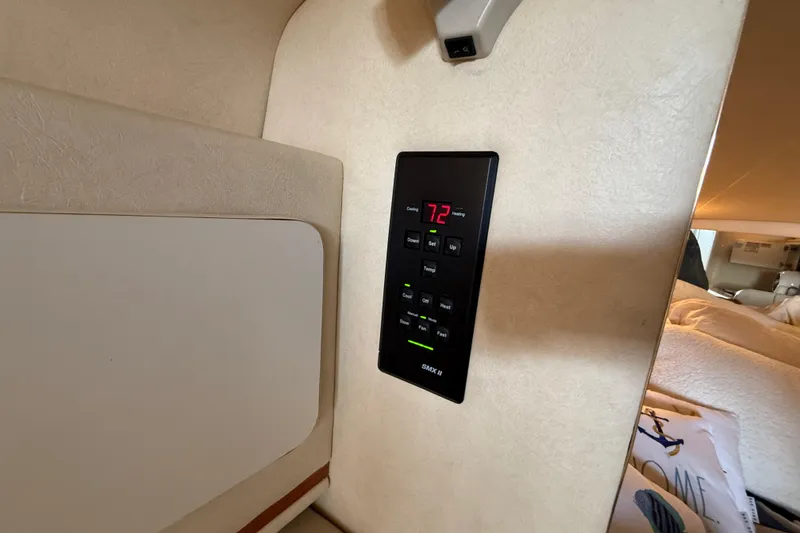 Slide: The Image of Digital thermostat inside 2000 Sea Ray 270 Sundancer boat cabin, displaying 72 degrees. - 21