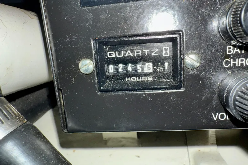 Slide: The Image of Hour meter reading 2456 on a 2000 Sea Ray 270 Sundancer boat dashboard. - 26