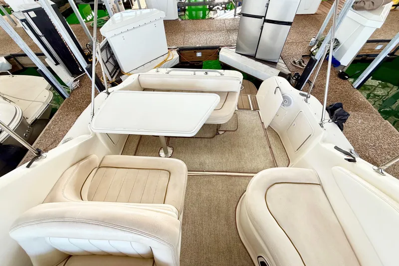 Slide: The Image of Interior of 2000 Sea Ray 270 Sundancer boat with seating and table. - 3