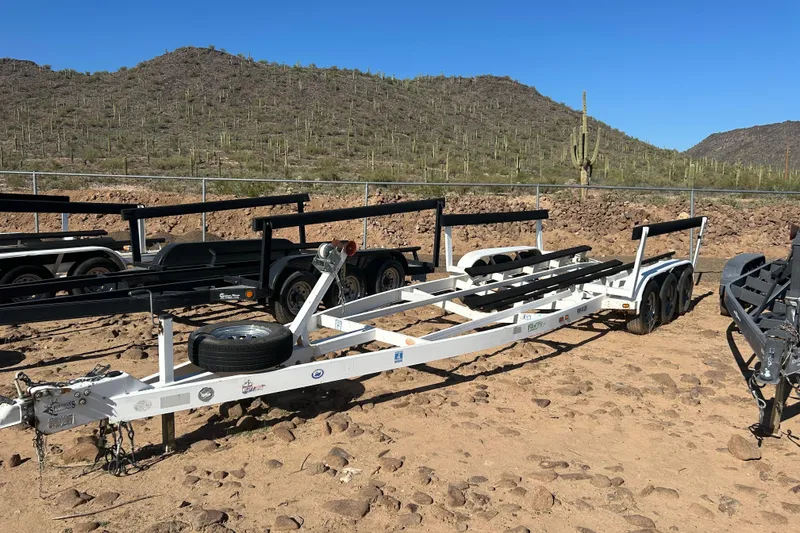 Slide: The Image of Boat trailer for 2000 Sea Ray 270 Sundancer on rocky desert terrain. - 31