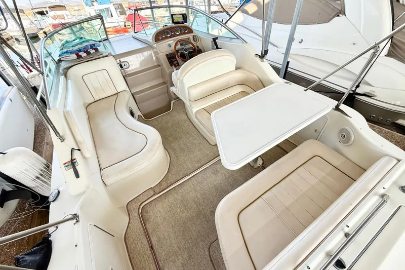 Slide: The Image of Interior of 2000 Sea Ray 270 Sundancer boat with seating and table. - 4