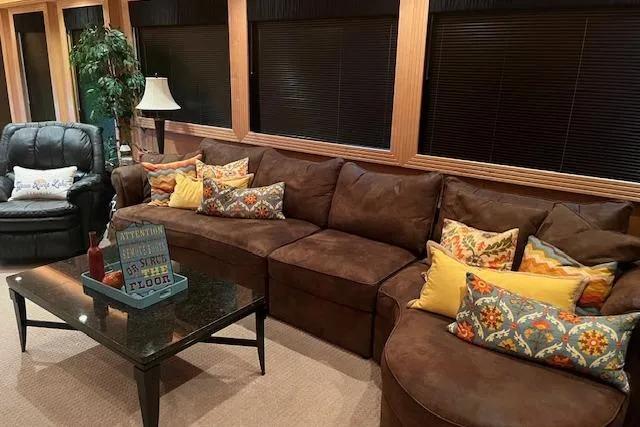 Slide: The Image of Luxurious 2008 Fantasy houseboat interior with plush brown sofa, colorful pillows, and elegant decor. - 3