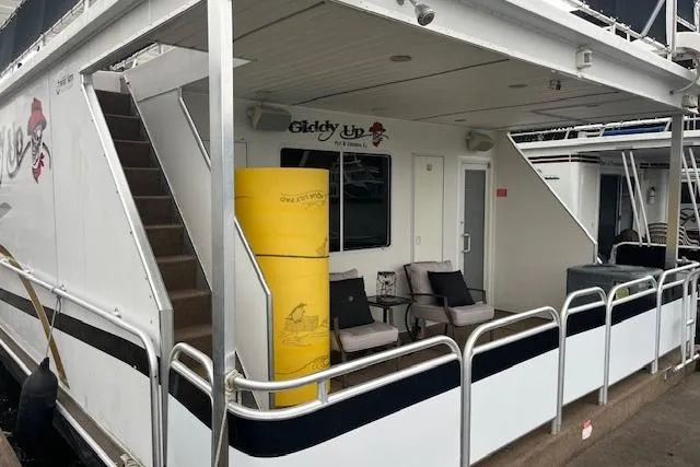 Slide: The Image of Houseboat with seating area, stairs, and "Giddy Up" sign, Fantasy model, 2008. - 31