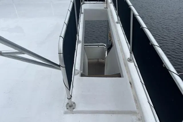 Slide: The Image of Stairway on 2008 Fantasy Houseboat deck, overlooking water. - 32