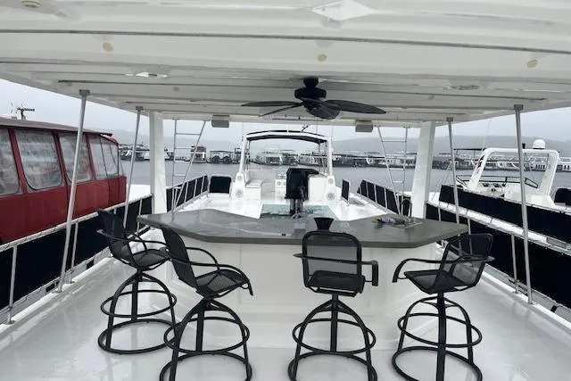 Slide: The Image of Luxurious 2008 Fantasy houseboat with bar stools and spacious deck overlooking marina. - 33