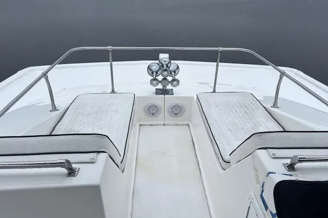 Slide: The Image of 2008 Fantasy Houseboat deck with seating and railing on calm water. - 35