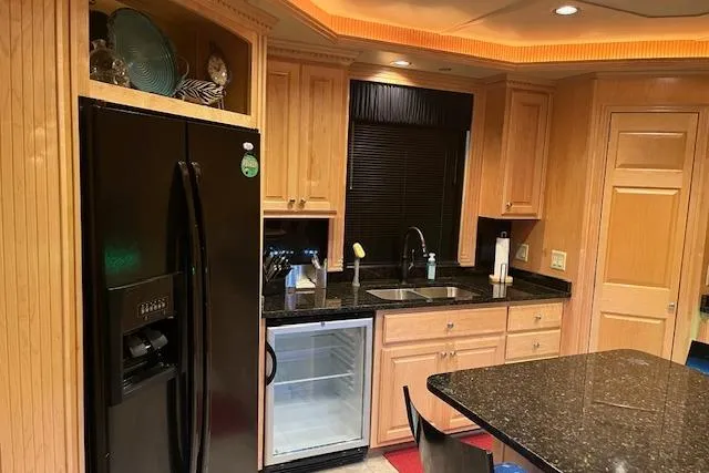 Slide: The Image of Luxurious 2008 Fantasy houseboat kitchen with modern appliances and elegant wood cabinetry. - 5