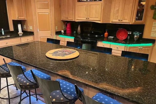 Slide: The Image of Luxurious kitchen in a 2008 Fantasy houseboat with granite countertops and stylish seating. - 8