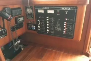 Slide: The Image of 1995 Hunter Legend 37.5 yacht control panel with navigation and communication equipment. - 16