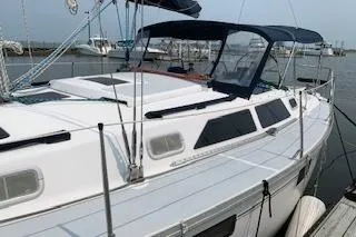 Slide: The Image of 1995 Hunter Legend 37.5 sailboat docked at a marina. - 2