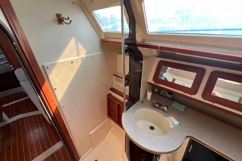 Slide: The Image of Interior of 1995 Hunter Legend 37.5 sailboat bathroom with sink and mirrors. - 22
