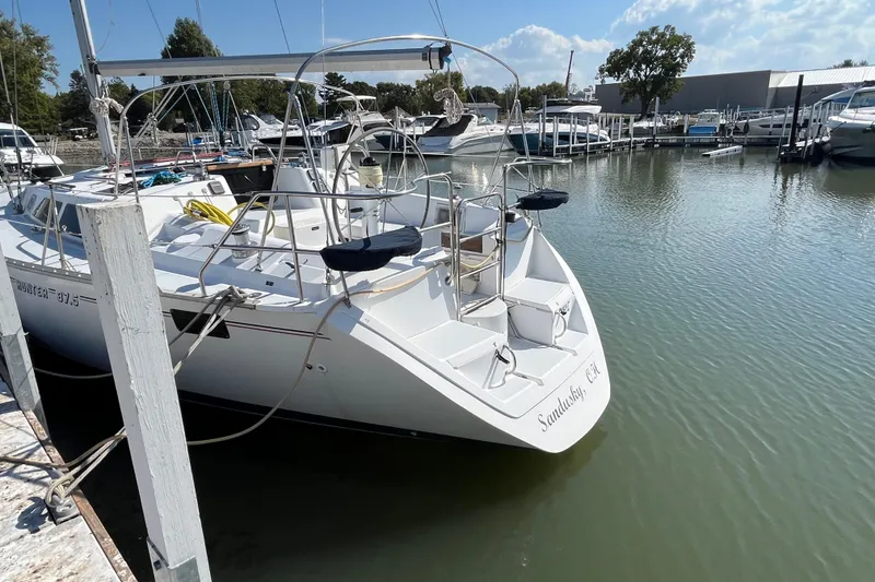 Slide: The Image of 1995 Hunter Legend 37.5 sailboat docked in a marina, sunny day, calm waters. - 5