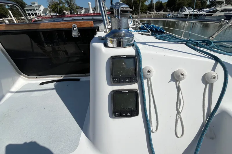Slide: The Image of Cockpit of 1995 Hunter Legend 37.5 sailboat with navigation instruments and winch. - 8