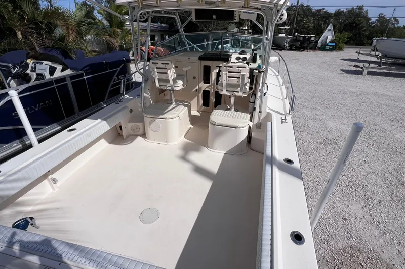 Slide: The Image of 2005 Parker 2510 Walkaround boat interior with seating and control panel. - 16