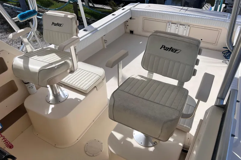Slide: The Image of 2005 Parker 2510 Walkaround boat interior with two cushioned seats. - 21