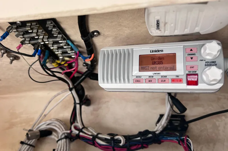 Slide: The Image of Uniden UM385 radio and wiring inside a 2005 Parker 2510 Walkaround boat. - 34