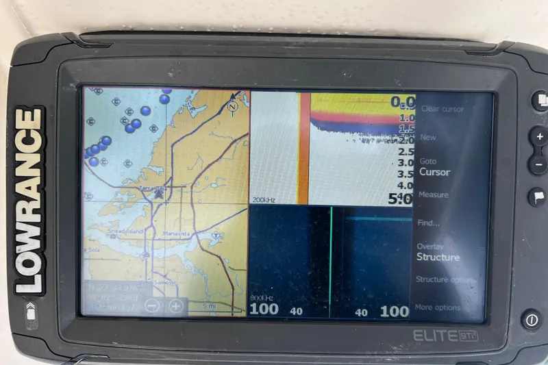 Slide: The Image of Lowrance Elite GPS display on 2005 Parker 2510 Walkaround boat, showing navigation and sonar data. - 35