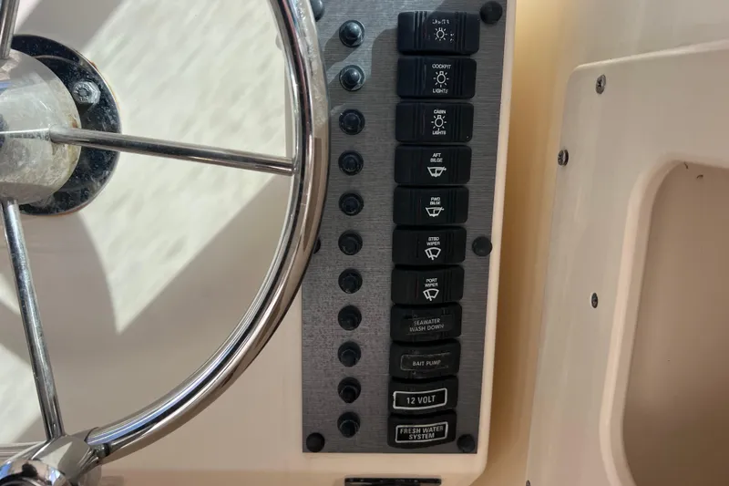 Slide: The Image of Control panel and steering wheel of 2005 Parker 2510 Walkaround boat. - 36