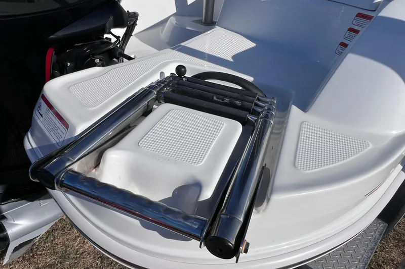 Slide: The Image of 2019 Tahoe 450 TS boat with a folded stainless steel swim ladder on the deck. - 11