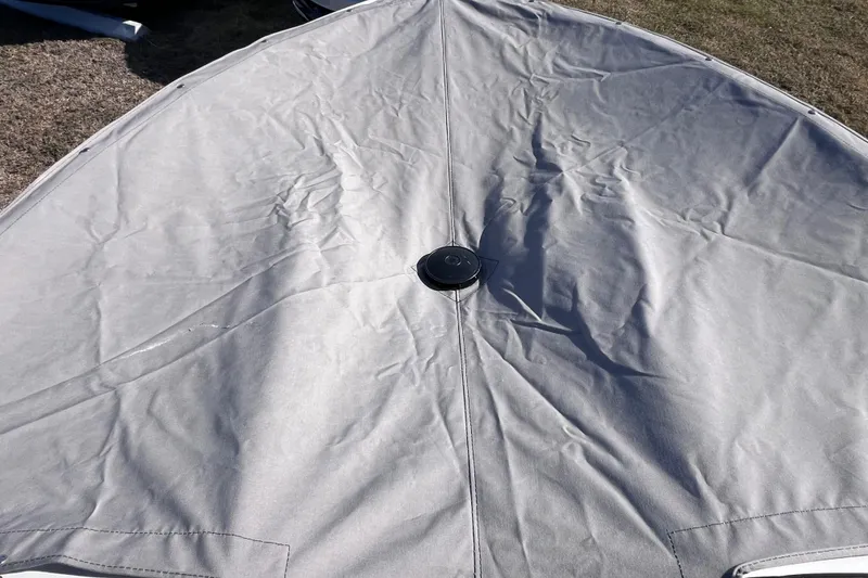 Slide: The Image of Boat cover on a 2019 Tahoe 450 TS, showing a taut, gray fabric surface. - 13