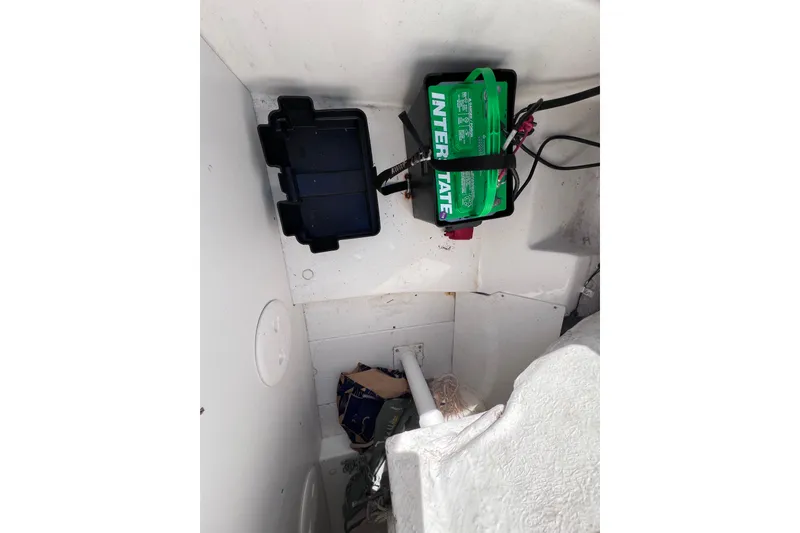 Slide: The Image of Battery compartment of a 2019 Tahoe 450 TS boat with Interstate battery. - 15