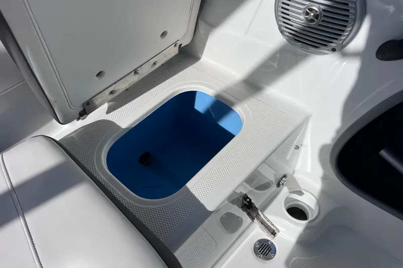 Slide: The Image of Open storage compartment in 2019 Tahoe 450 TS boat interior. - 19