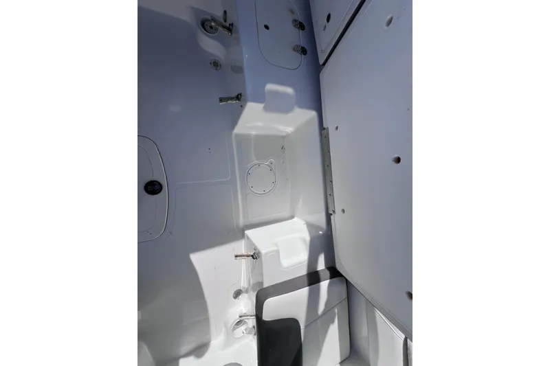 Slide: The Image of Interior view of a 2019 Tahoe 450 TS boat, showcasing storage compartments. - 21