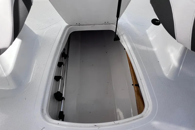 Slide: The Image of Open storage compartment on a 2019 Tahoe 450 TS boat deck. - 28