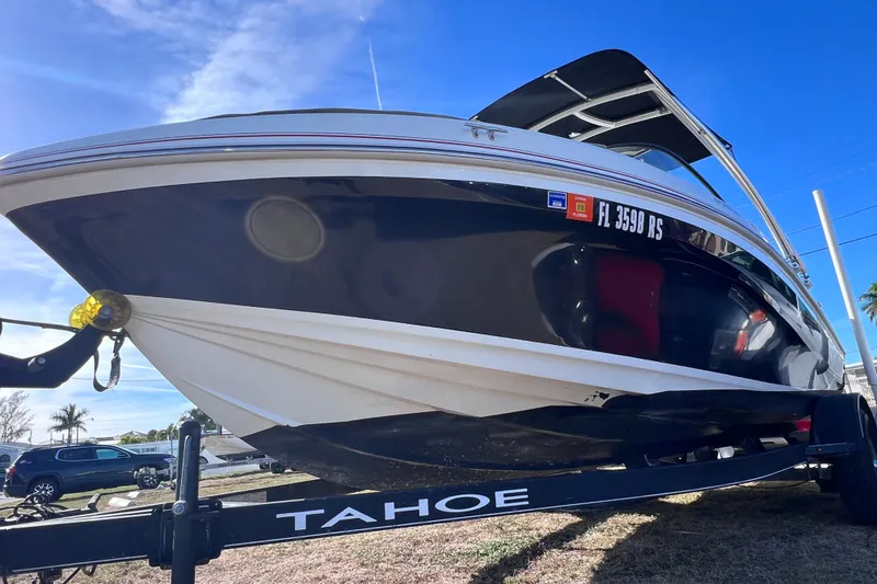 Slide: The Image of 2019 Tahoe 450 TS boat on trailer, viewed from below, with clear blue sky background. - 3