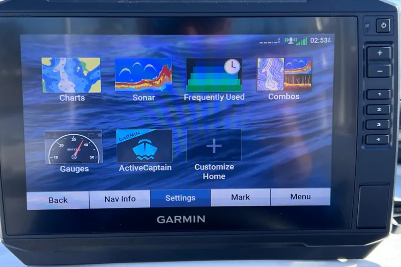 Slide: The Image of Garmin marine display showing navigation options on a 2019 Tahoe 450 TS boat. - 39